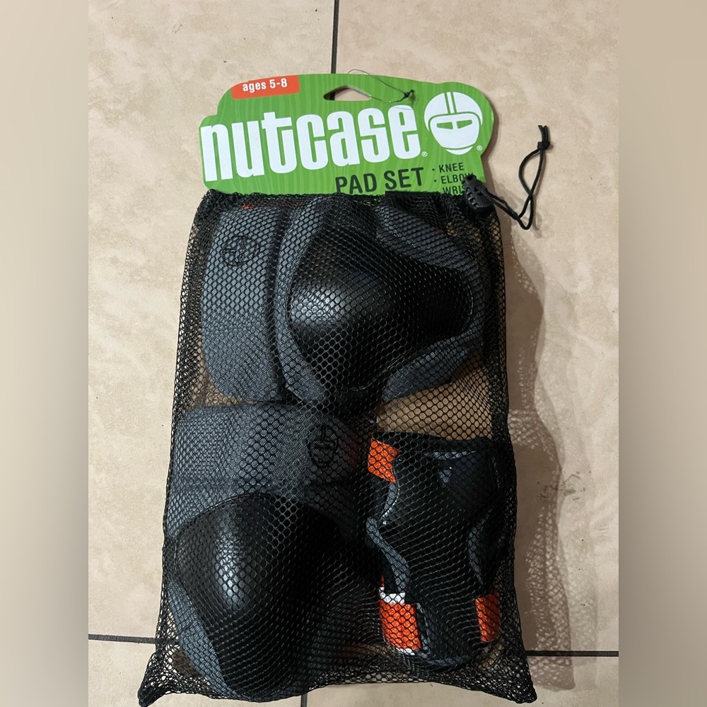 Nutcase Child Pad Set Black Orange Knee Elbow Wrist Pads.